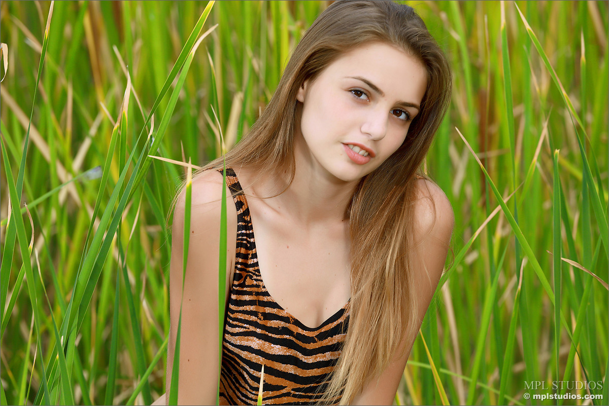 Photo #1 of Elle posing in Hiding in the Grass