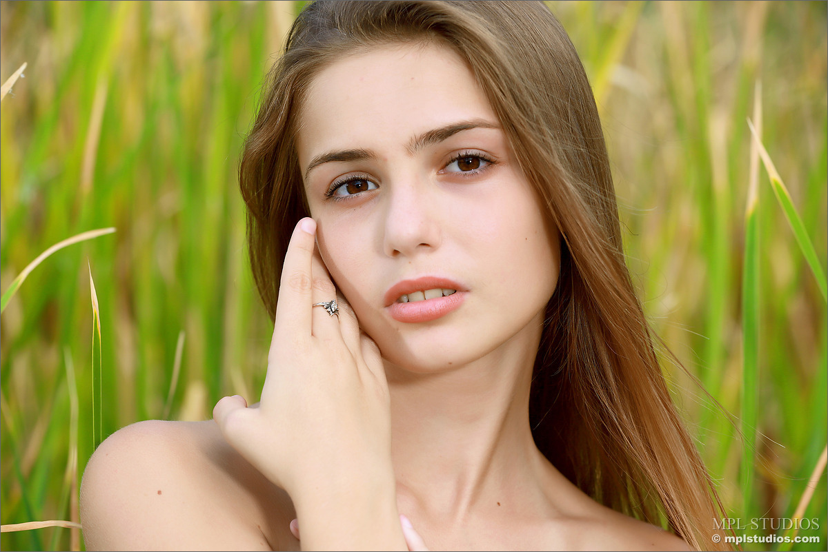 Photo #6 of Elle posing in Hiding in the Grass II